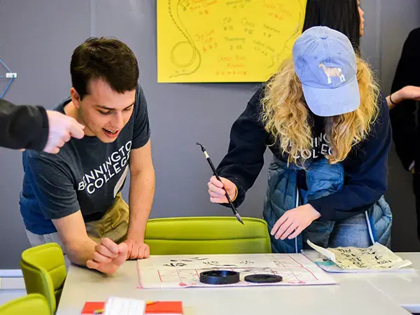 Student practicing Chinese calligraphy