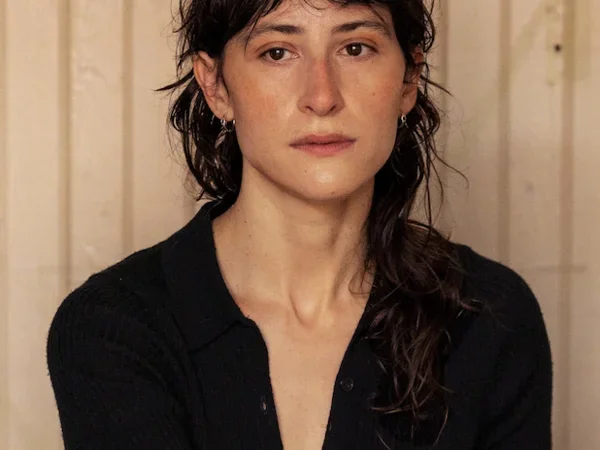 Photo of Olivia Gerber seated wearing a black shirt