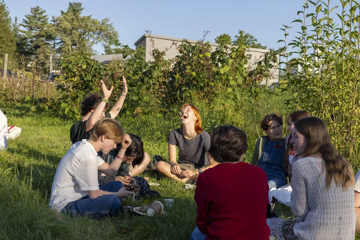 Image of students laughing outside