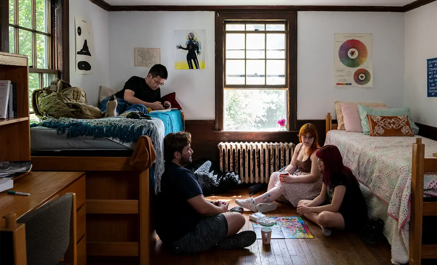 students gathered in dorm room