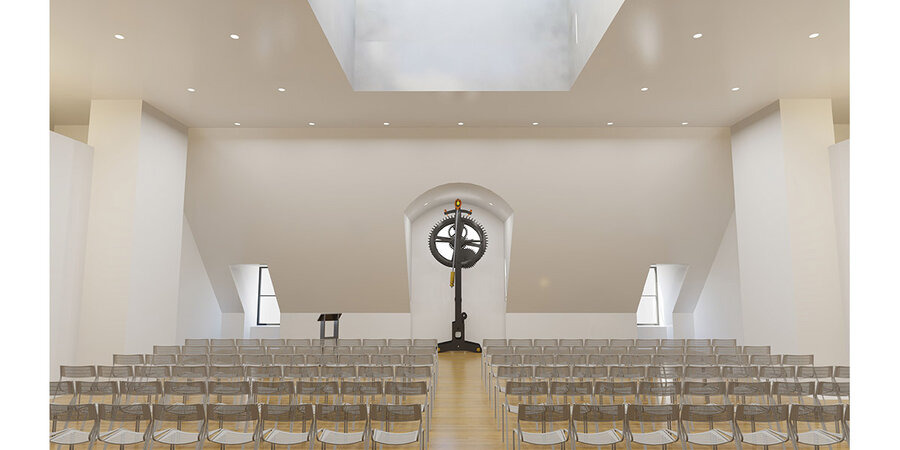 white room with rows of clear chairs