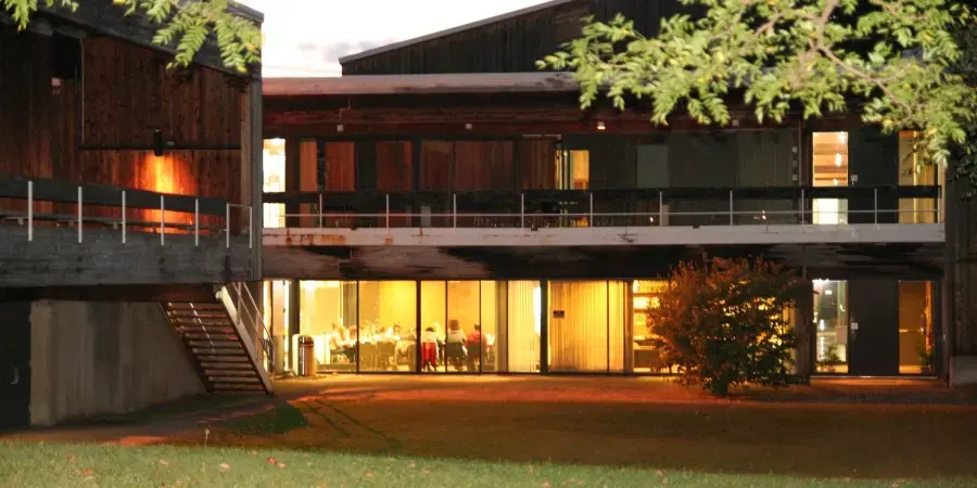 dickinson at night, wooden building with lights on