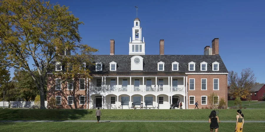 Shot of Commons building with students walking in the foreground