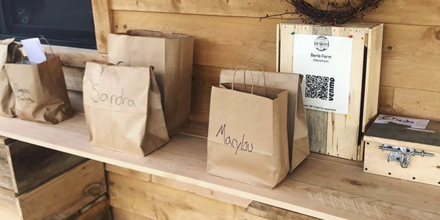 Paper bags on wooden shelf in a wooden room