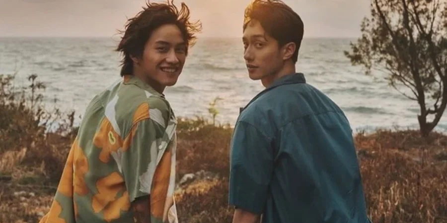 Image of two men looking at camera