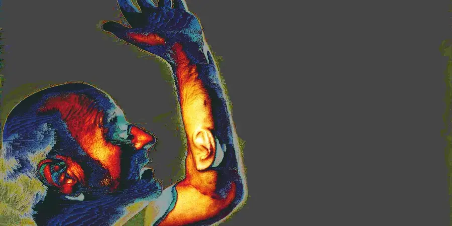 colourful man with ear on arm