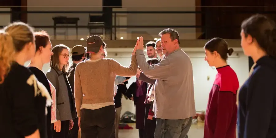 Image of two people high fiving