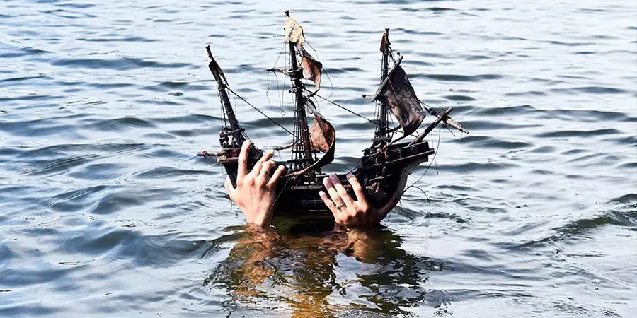 boat held up by a person under the water