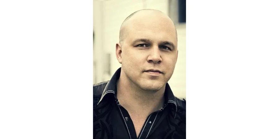 Matthew Olzmann headshot on bright background