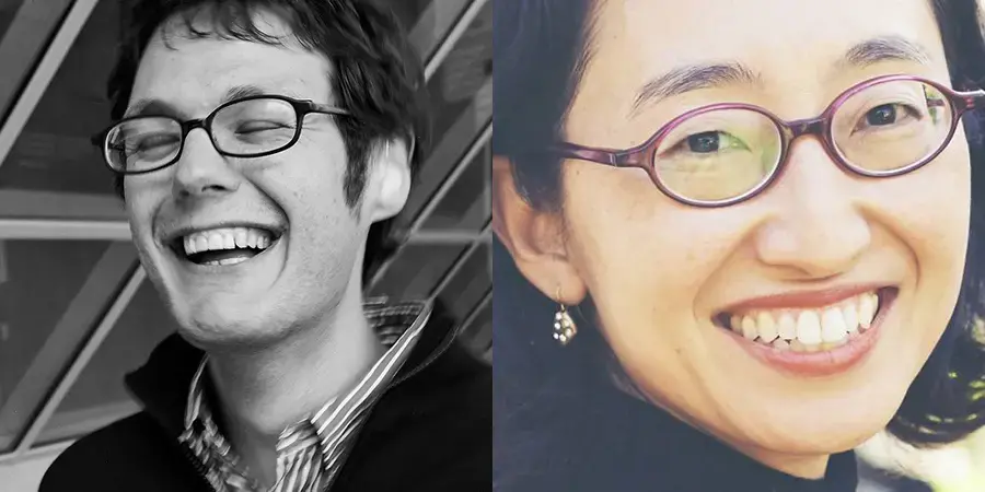 man in glasses laughing and woman wearing glasses smiling close up