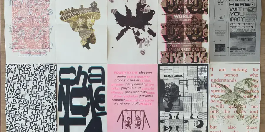 brightly printed posters from the bring it home show on a table