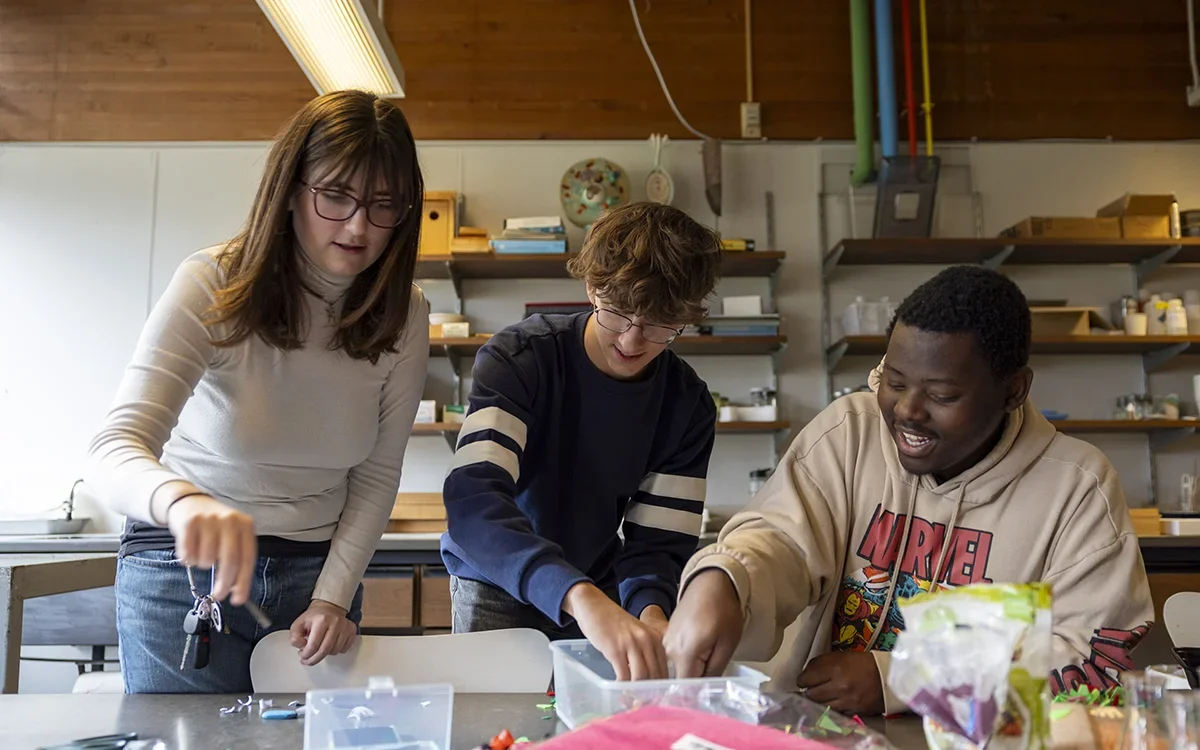 Three students working on project