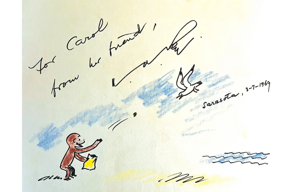 Curious George tosses crumbs to a seagull