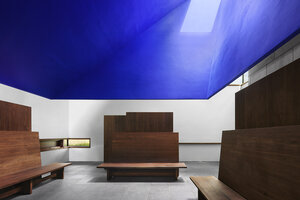 meditation space in capa with blue ceiling and wooden benches