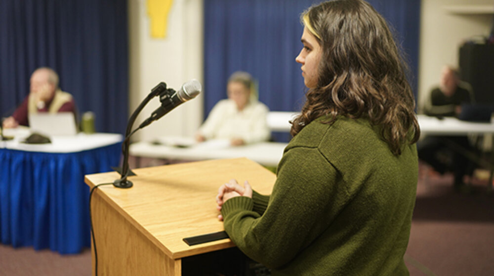 Image of woman at podium