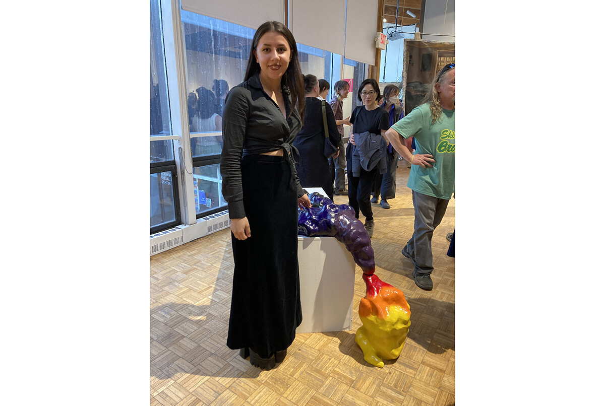 Image of Raven Realmuto ’23 with her piece. 