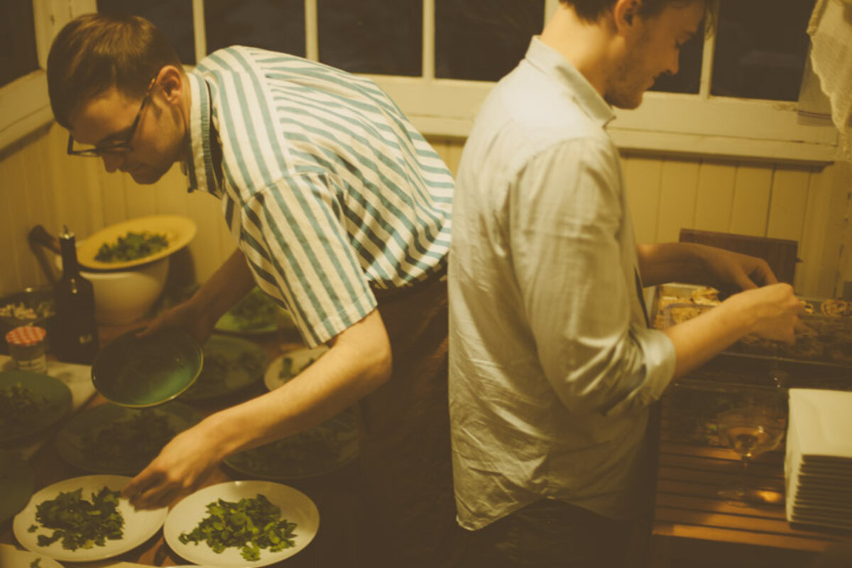 Andrew Barton and Lucas plating green sage flowers in the background