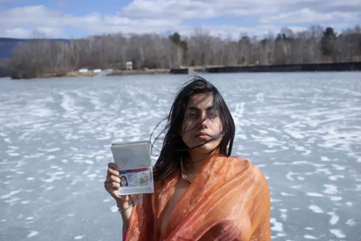 photo of woman standing in snow