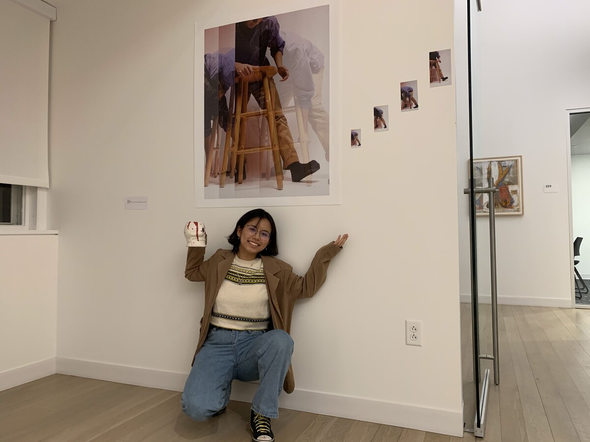 Photo of woman posing by photograph