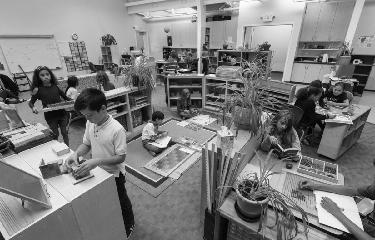 children working in an art studio in black and white