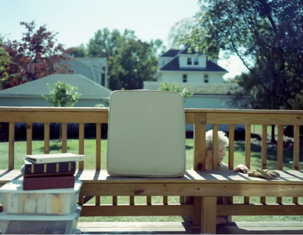 Photo of woman behind railing