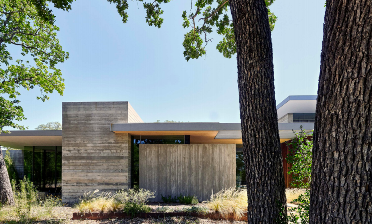 The Cuernavaca Residence- a concrete and walnut wood building with glass walls- from outside