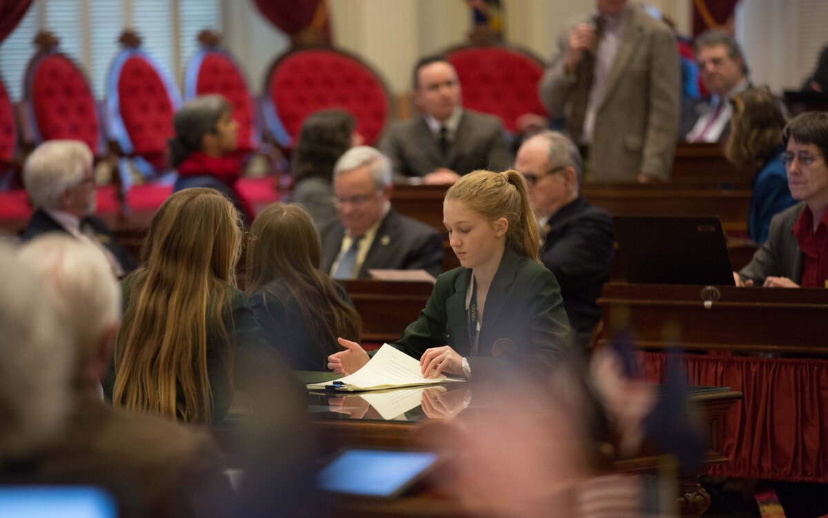 student in a meeting at the statehouse
