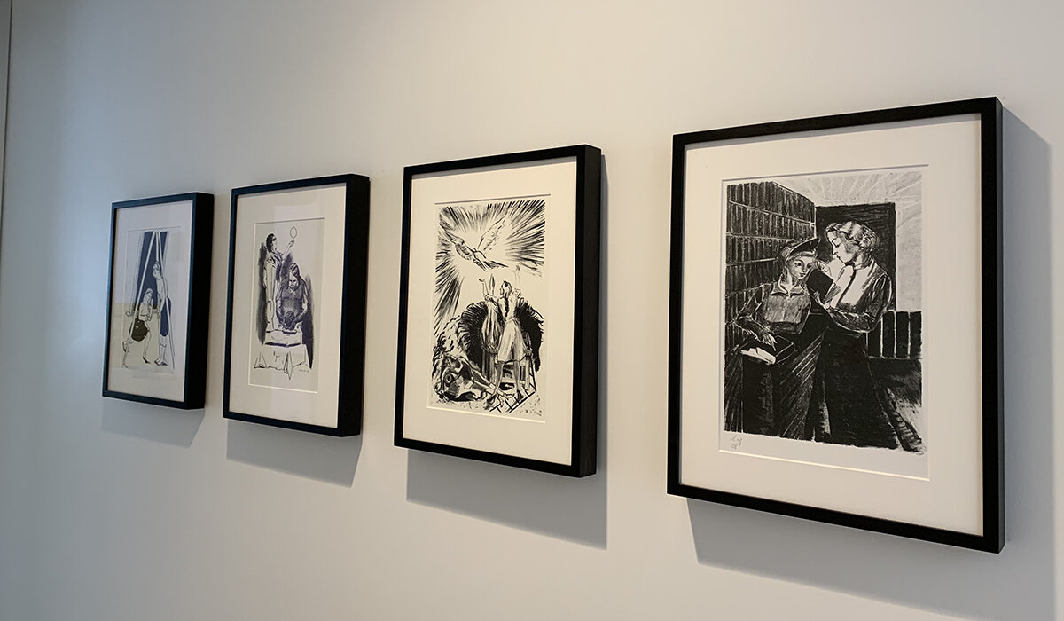 four black and white framed images on a white wall 