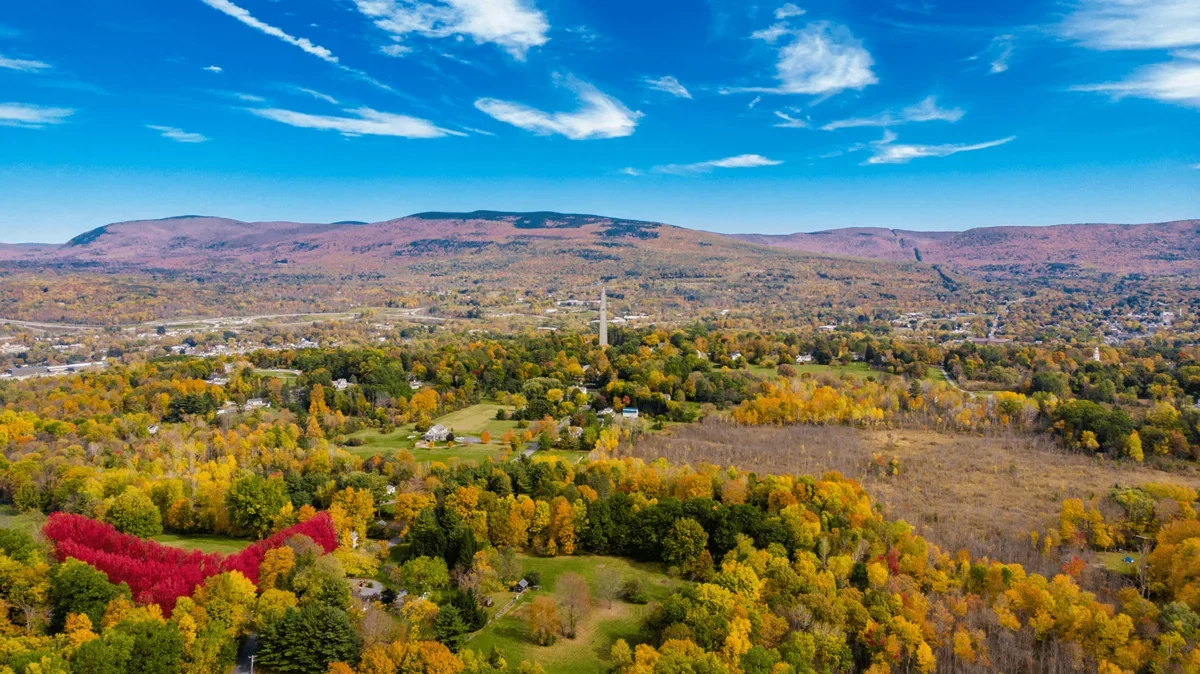 an aerial view of Bennington, VT with the battle monument at its center
