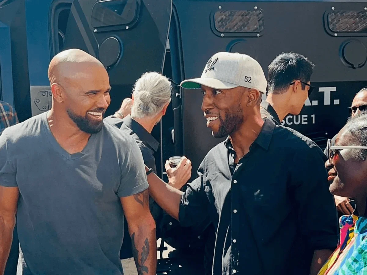 Aaron Rahsaan Thomas speaks to cast on the set of S.W.A.T.