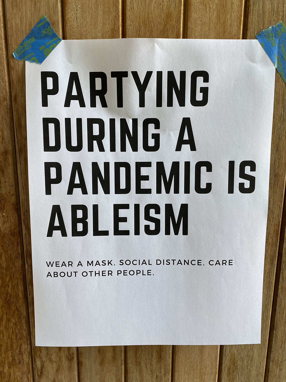 Image of sign partying during a pandemic is ableism