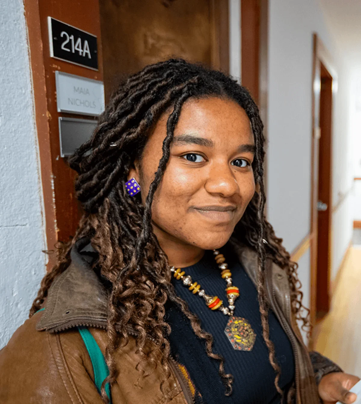 a student smiles for the camera