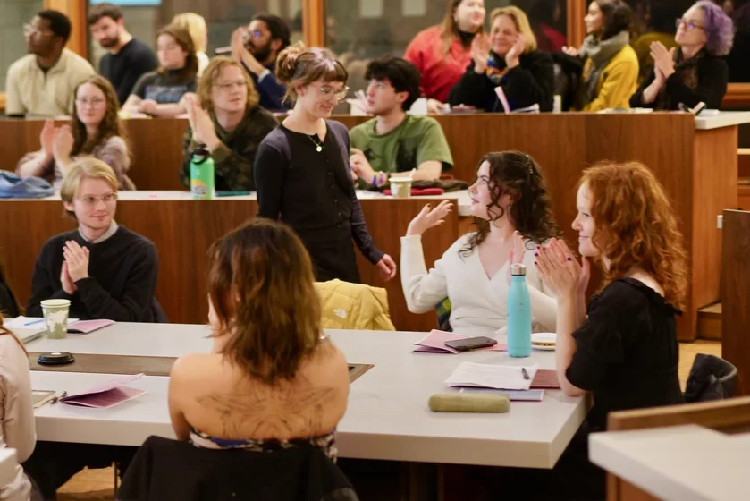 Image of students clapping