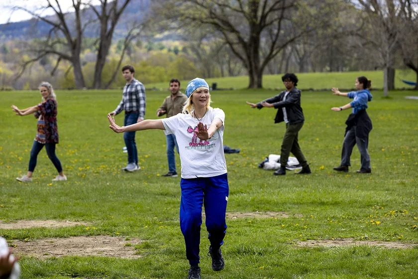 Woman dancing on lawn