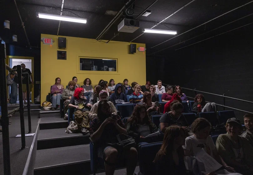 Students sit in Kinoteca and wait for the film to start