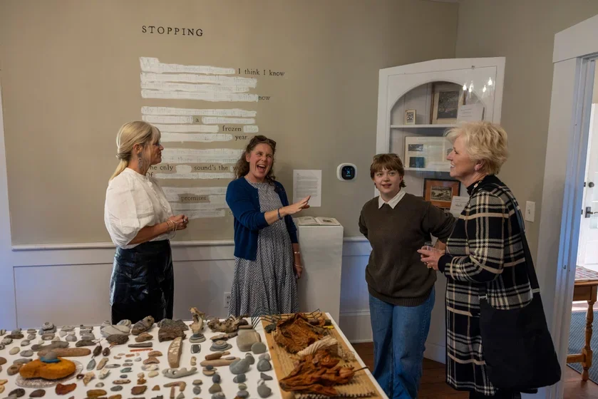President Danielle Egan and Erin McKenny, director of the Robert Frost Stone House Museum, host guests to the Judith Belzer '78's exhibition Walking Project: Animal, Vegetable, Mineral. 