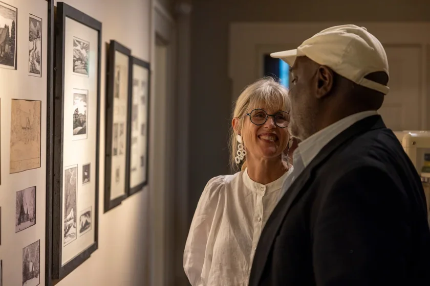 President Danielle Egan enjoys Judith Belzer '78's exhibition Walking Project: Animal, Vegetable, Mineral at the Robert Frost Stone House Museum with faculty member in Music Michael Wimberly. 