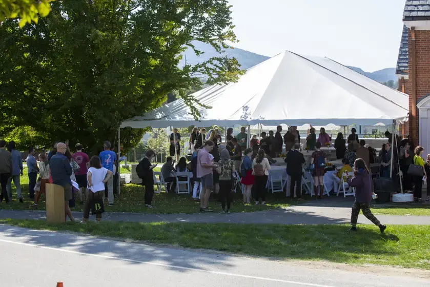 Crowd under a white tent