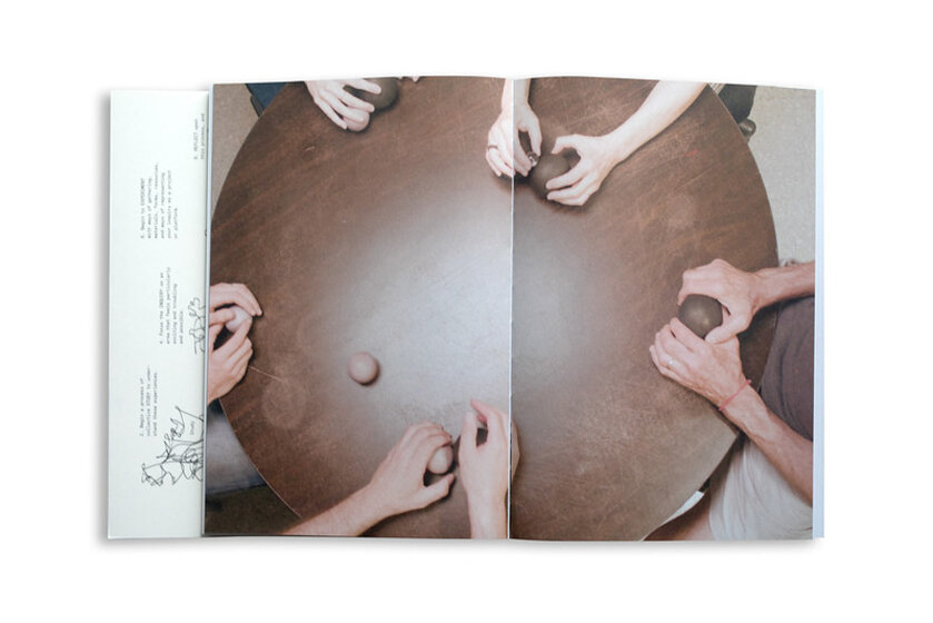 Image of hands surrounding table