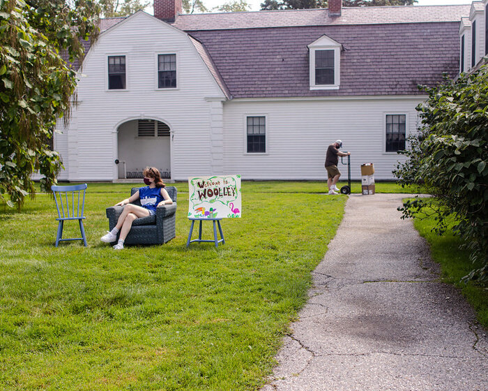 Image of student sitting on front lawn