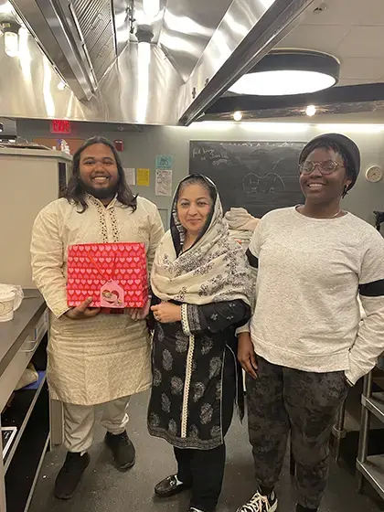 Image of 3 people in a kitchen