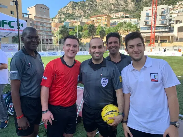 Photo of Mohammadzadeh with FIFCO referees