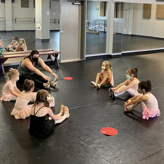 Image of ballet students stretching