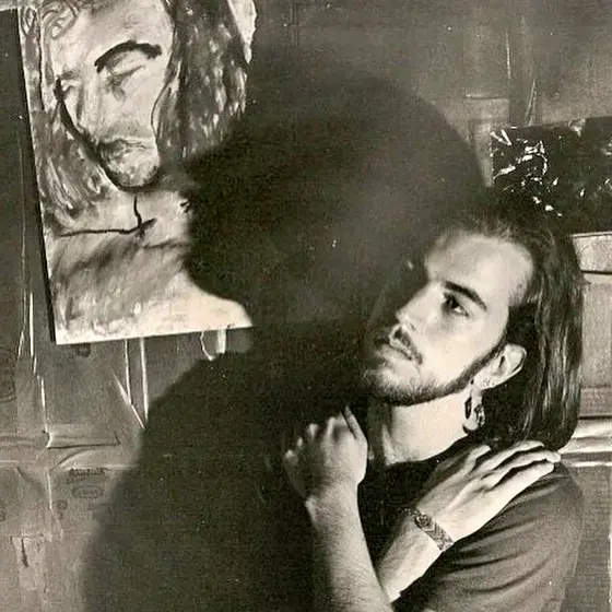 Image of man standing by self portrait