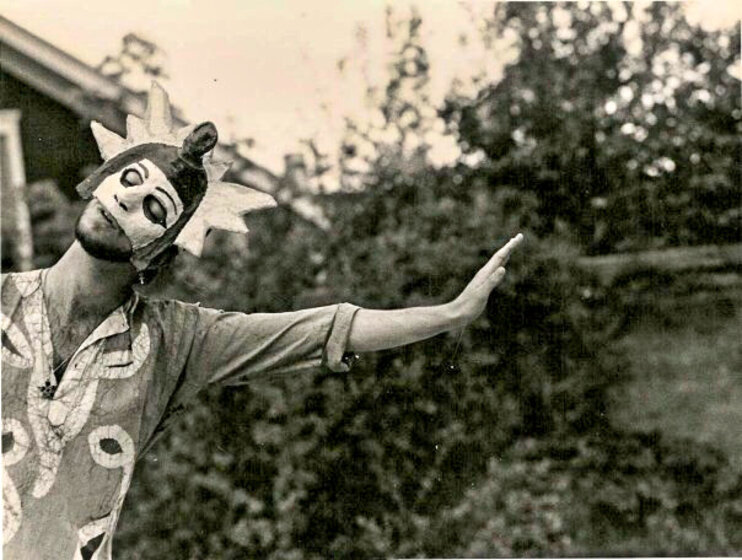 Image of man in mask dancing