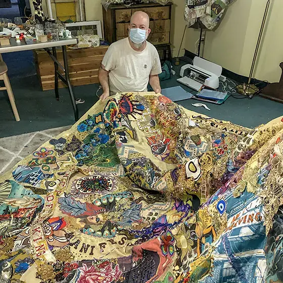 Michael Sylvan Robinson at work on Jordan Roth's Met Gala coat