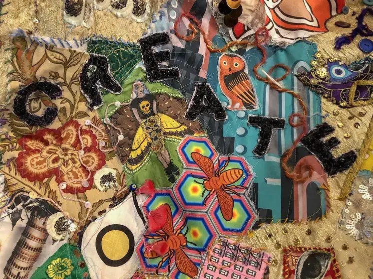 Close up on fabric saying create