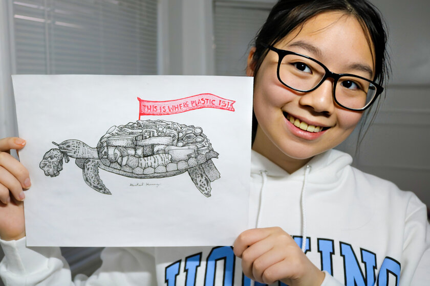 Photo of girl holding turtle poster