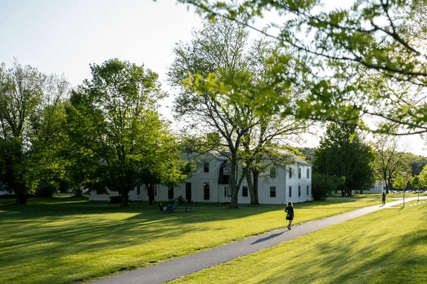a student walks on the beautiful Bennington College campus