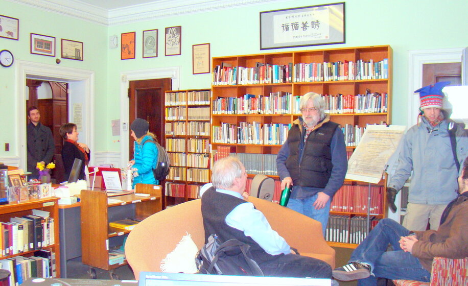 a group of visitors in the music library 